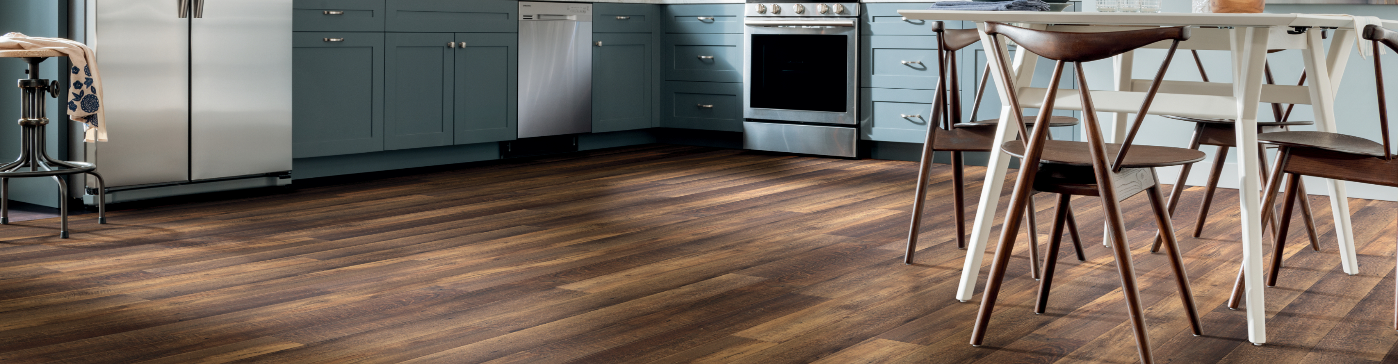 Dark plank luxury vinyl COREtec flooring in kitchen 